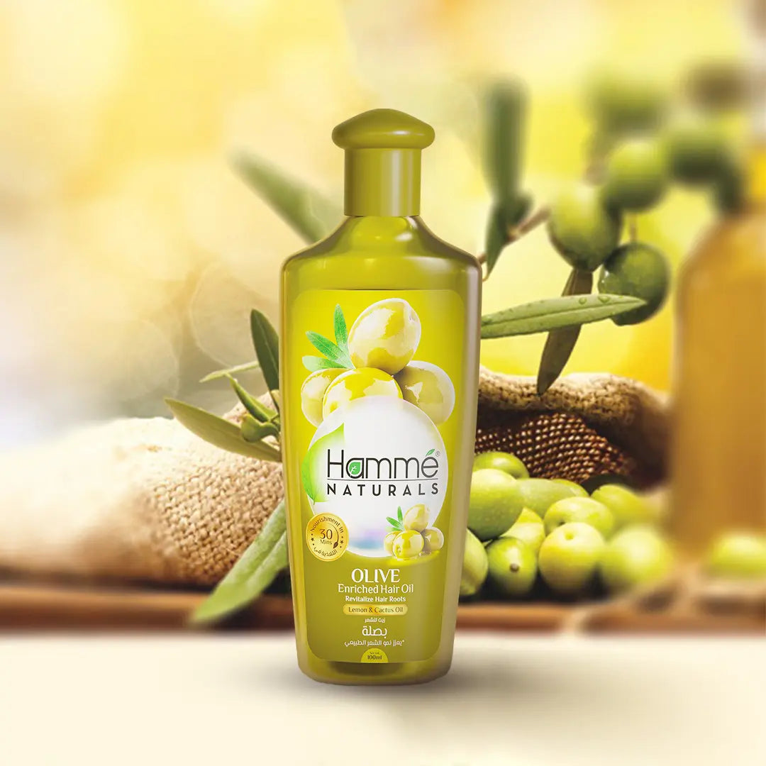 Olive Enriched Hair Oil - Hammé - Makes You Stand out  - A bottle of coconut oil beside a coconut, highlighting its natural benefits for nourishing hair health